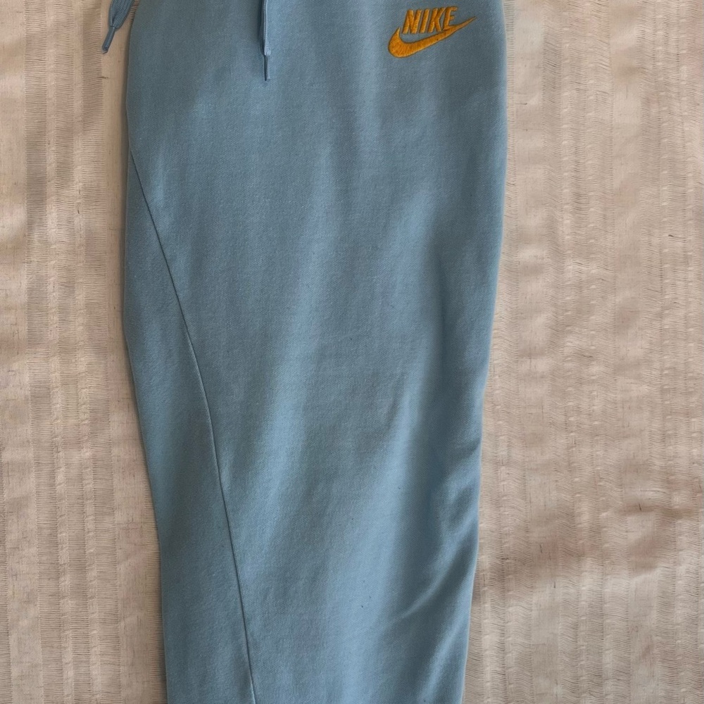 Nike Womens Light Blue Joggers with Orange Logo